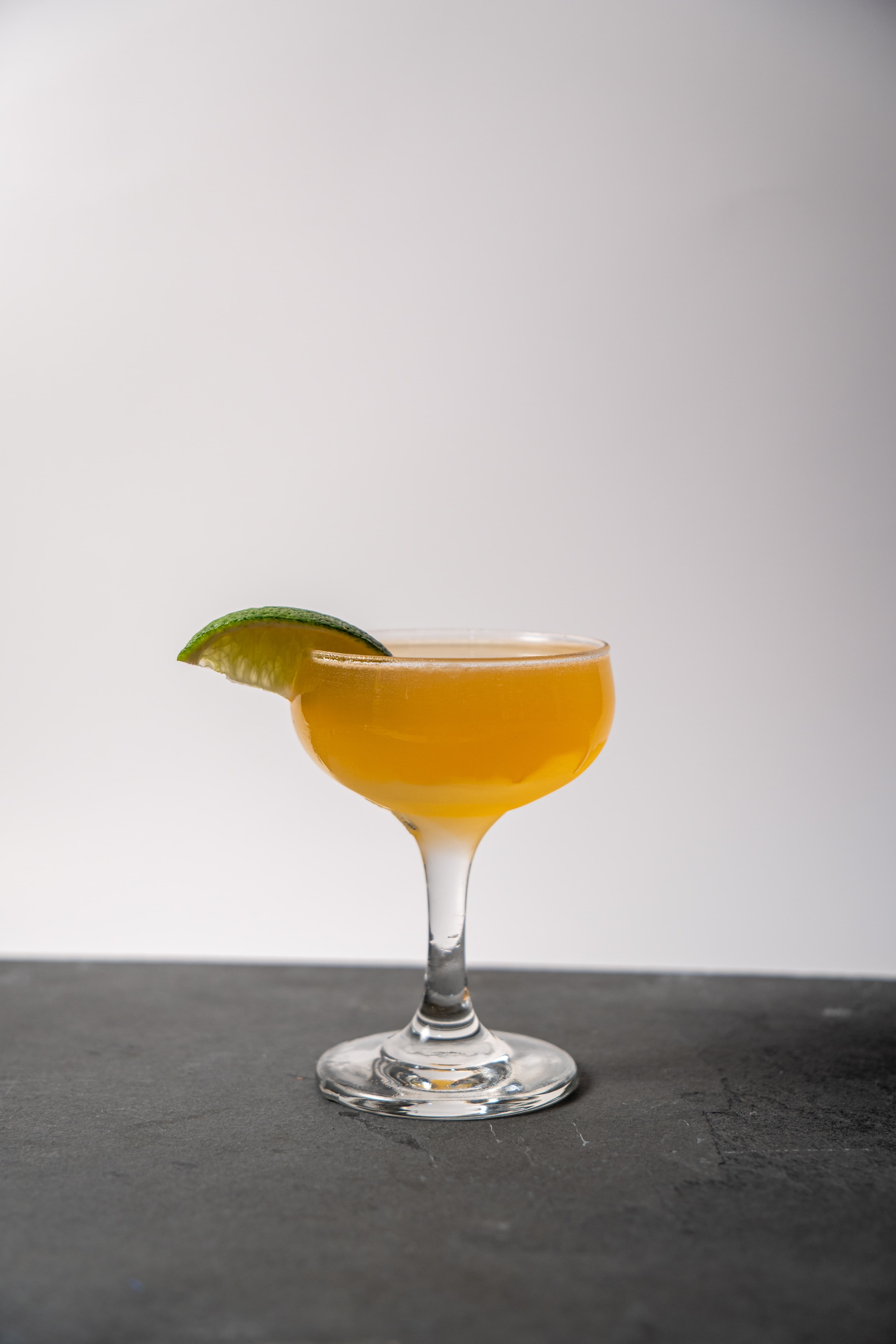 A freshly poured daiquiri-style cocktail in a coupe glass